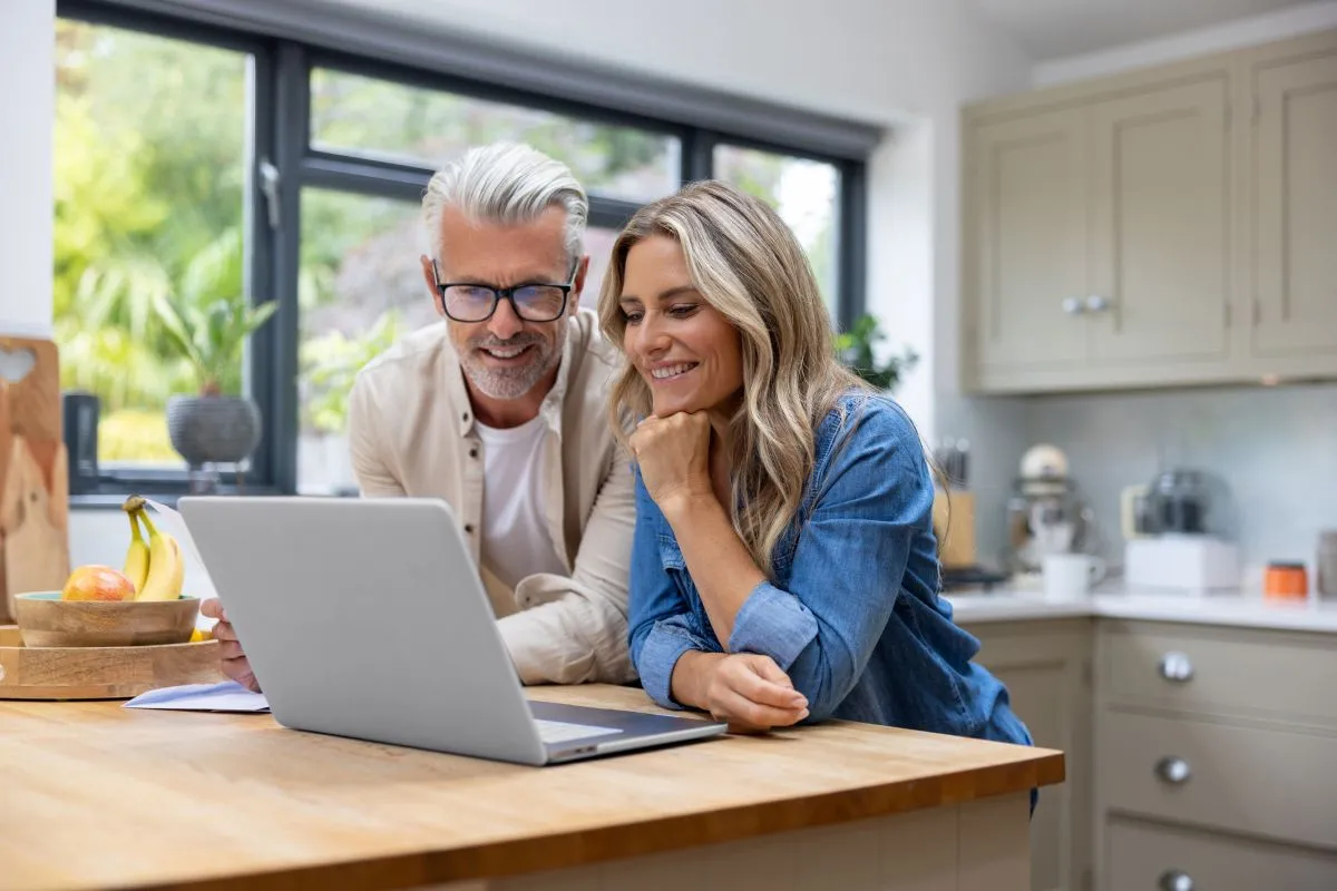 Couple browsing shutters online